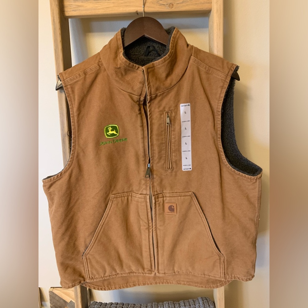 Carhartt brown vest with John Deere logo. Size Large with Sherpa lining.